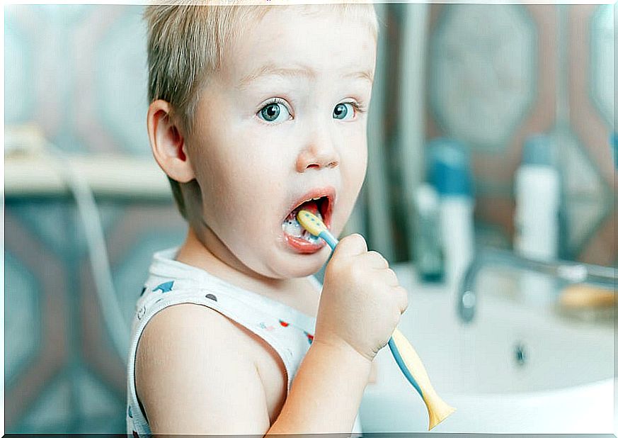 Little boy brushing his teeth.