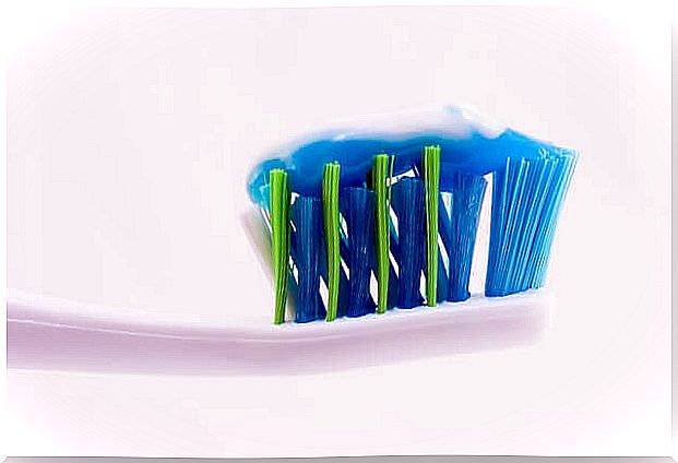 Brush with toothpaste.