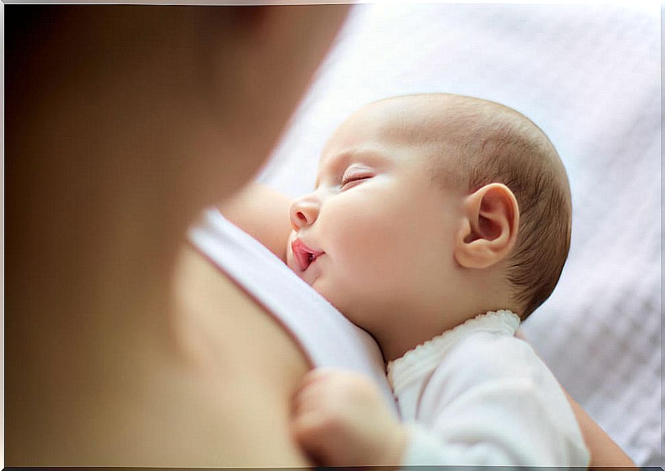 Baby sleeping on mother