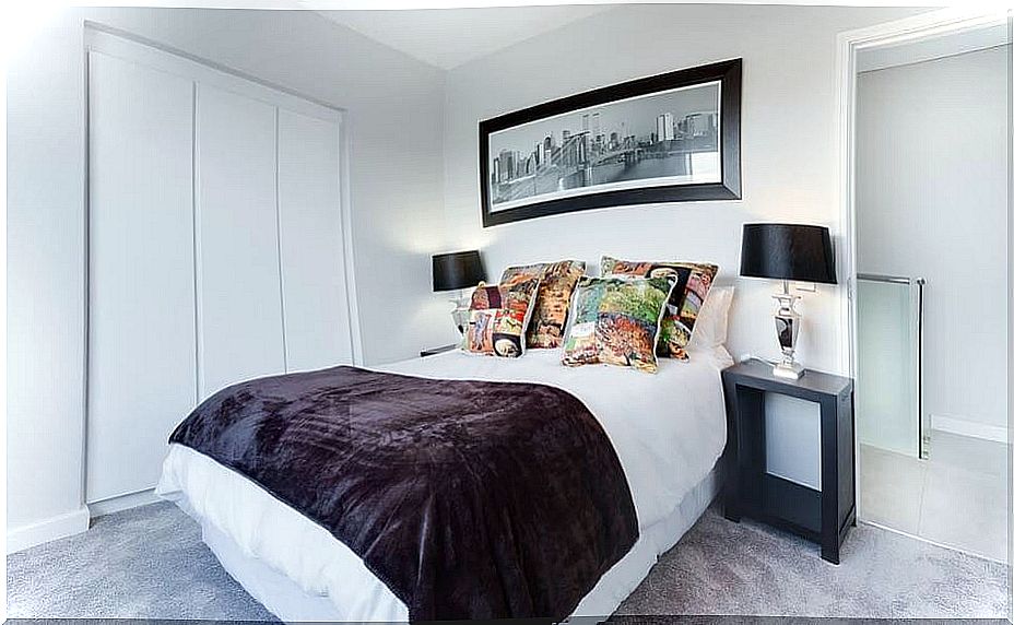 The bedroom of a house decorated in a minimalist style.