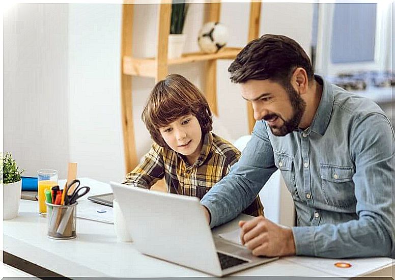 Father helping his son with homework.